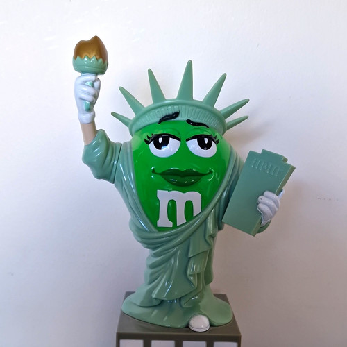 Green character statue of - character,